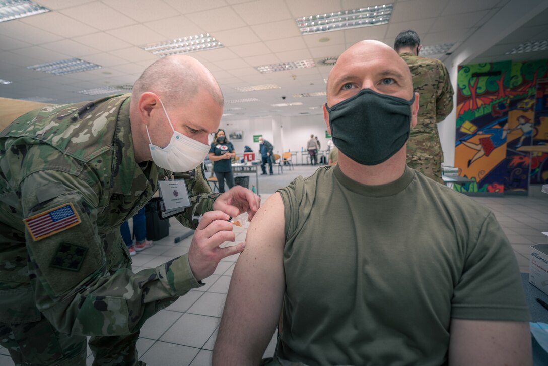 A soldier receives his final COVID-19 vaccine.