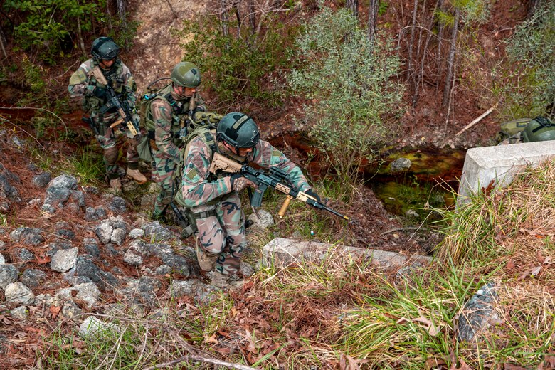 Dutch Marines with 32nd Raiding Squadron advance to the next objective during Exercise Caribbean Urban Warrior on Camp Lejeune, N.C., March 15, 2021. The exercise is a bilateral training evolution designed to increase global interoperability between 2d Reconnaissance Battalion, 2d Marine Division and 32nd Raiding Squadron, Netherlands Marine Corps. (U.S. Marine Corps photo by Lance Cpl. Jacqueline Parsons)