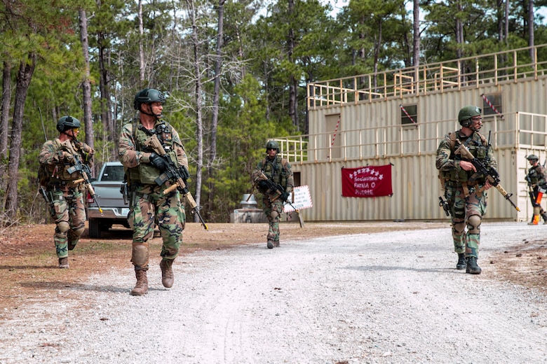 Dutch Marines with 32nd Raiding Squadron patrol during Exercise Caribbean Urban Warrior on Camp Lejeune, N.C., March 15, 2021. The exercise is a bilateral training evolution designed to increase global interoperability between 2d Reconnaissance Battalion, 2d Marine Division and 32nd Raiding Squadron, Netherlands Marine Corps. (U.S. Marine Corps photo by Lance Cpl. Jacqueline Parsons)
