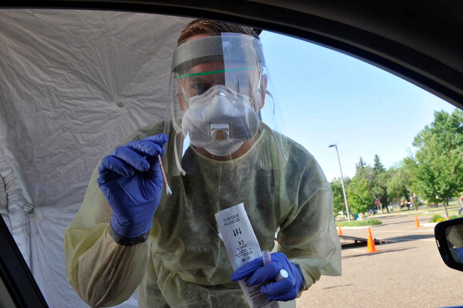 Spc. Collin Ahmann, North Dakota Army National Guard Medical Detachment, prepares to collect a COVID-19 test specimen at the North Dakota state capitol in Bismarck July 6, 2021. The Guard has supported the state's response to the pandemic since March 16, 2020.