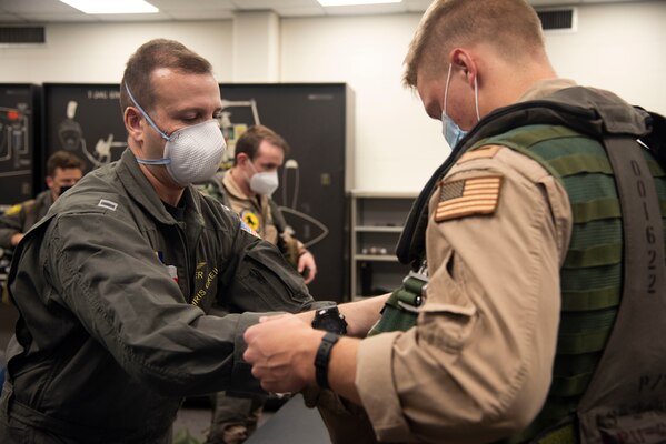 CORPUS CHRISTI, Texas (Oct. 19, 2020) Aerospace Physiologist Lt. Chris Greil teaches student naval aviators survival procedures at Training Air Wing 4 aboard Naval Air Station Corpus Christi, Oct. 19. Greil was named the 2020 Chief of Naval Air Training AMSO of the Year and received the 2020 Military Health Systems (MHS) and Allied Health Excellence Leadership award. (U.S. Navy photo by Lt. Michelle Tucker/Released)
