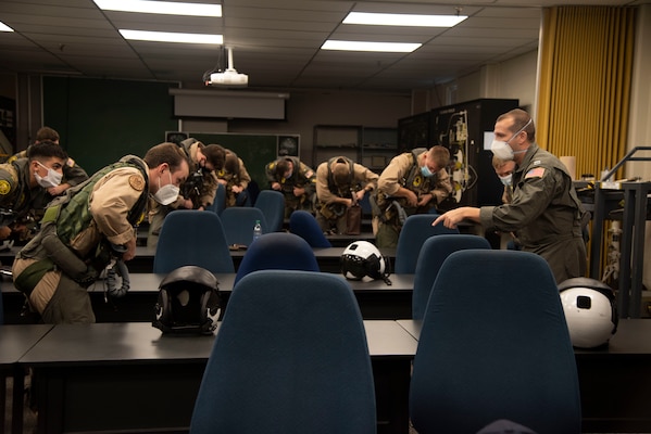 201019-N-OU681-1088 CORPUS CHRISTI, Texas (Oct. 19, 2020) Aerospace Physiologist Lt. Chris Greil teaches student naval aviators survival procedures at Training Air Wing 4 aboard Naval Air Station Corpus Christi, Oct. 19. Greil was named the 2020 Chief of Naval Air Training AMSO of the Year and received the 2020 Military Health Systems (MHS) and Allied Health Excellence Leadership award. (U.S. Navy photo by Lt. Michelle Tucker/Released)