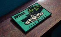 210218-N-PS962-1083 (Feb. 18, 2021) Officers aboard the guided-missile destroyer USS Winston S. Churchill (DDG 81), receive a commemorative patch for completing 1,110 hours of bridge watchstanding while underway,  in accordance with the Mariners Skills log book. Winston S. Churchill is deployed to the U.S. 6th Fleet area of operations in support of regional allies and partners and U.S. national security interests in Europe and Africa. (U.S. Navy photo by Mass Communication Specialist 3rd Class Louis Thompson Staats IV)