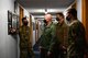 U.S. Air Force Senior Master Sgt. Aaron Boyle, left, the 709th Technical Maintenance Squadron (TMXS), Detachment 460 chief, talks about a photo with Col. David Berkland, the 354th Fighter Wing (FW) commander, and Chief Master Sgt. John Lokken, the 354th FW command chief, during a leadership immersion on Eielson Air Force Base, Alaska, March 11, 2021.