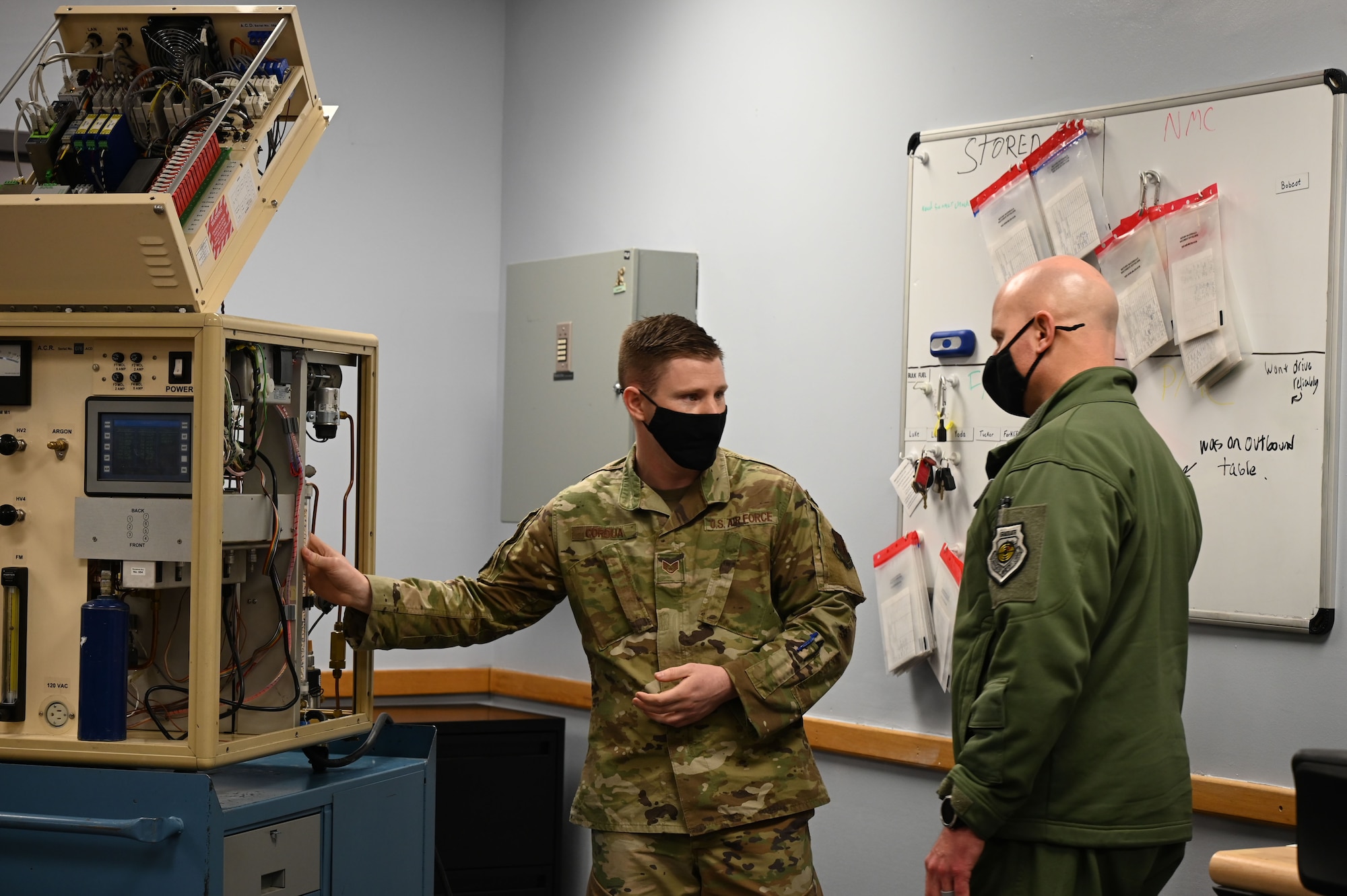 U.S. Air Force Staff Sgt. Thomas Cordua, a 709th Technical Maintenance Squadron (TMXS), Detachment 460 field maintenance supervisor, explains how an advanced automatic cryogenic rectifier (AACR) works to Col. David Berkland, the 354th Fighter Wing commander, during a leadership immersion on Eielson Air Force Base, Alaska, March 11, 2021.