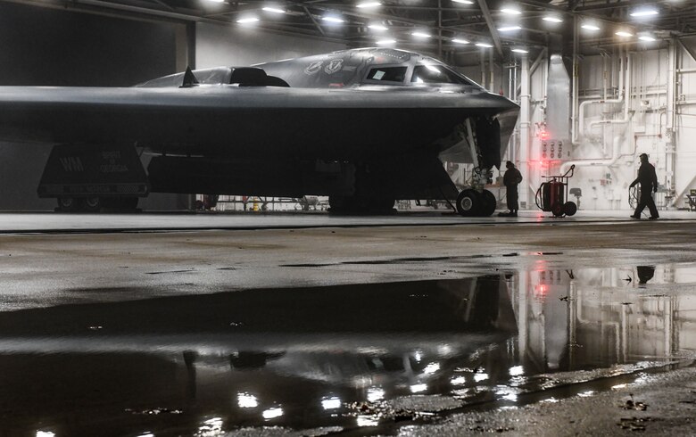 U.S. Air Force Senior Airman Tony Nogales, left, and Airman 1st Class Byron Humphrey, 509th Aircraft Maintenance Squadron crew chiefs, conclude preflight checks in support of a Bomber Task Force at Whiteman Air Force Base, Missouri, March 16, 2021. The B-2 Spirit's low-observable, or 