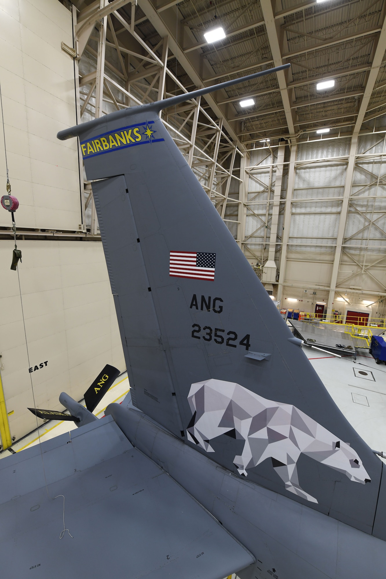 Tech. Sgt. Matthew Barker and Airman 1st Class Caleb Sawyer of the 168th Maintenance Group adds Fairbanks, Alaska to the wing's flagship KC-135 Stratotanker and installs the new Polar Bear design on the tail flash dedicated to Fairbanks, Alaska, Dec. 18, 2020. The Alaska Air National Guard's 168th Wing honors Fairbanks, Alaska, the city it calls home, with the dedication of the wing's flagship aircraft. A flagship aircraft is a dedicated aircraft with the wing commander and the dedicated crew chiefs' names on it and is maintained to the highest standards. It is the jet that represents the wing. The dedicated crew chiefs for the flagship are Tech. Sgt. Robert Albaugh and Staff Sgt. Elliot St. Laurent. (U.S. Air National Guard photo by Senior Master Sgt. Julie Avey)