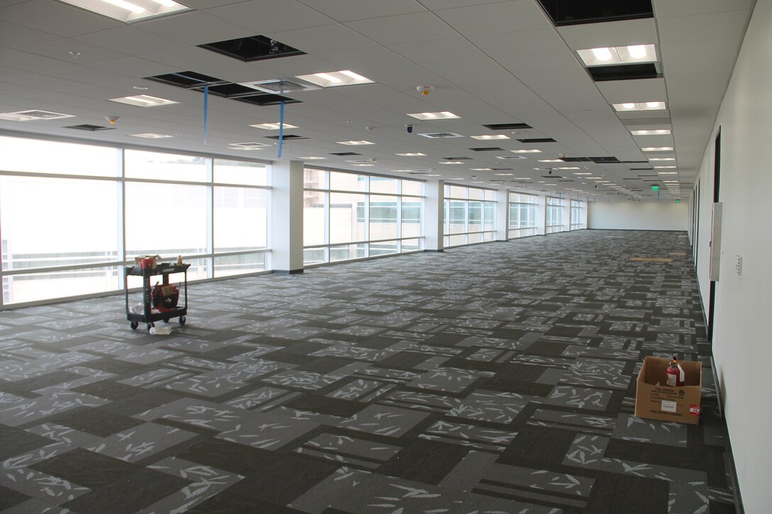 Flooring and ceiling fixture work is being finalized by the Honolulu District project team inside the U.S. Army Pacific's new Command and Control Facility at Fort Shafter.