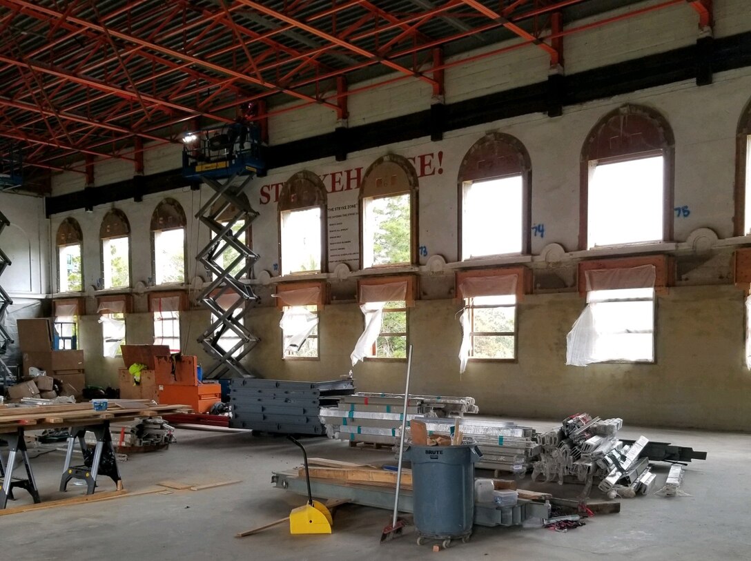Renovations to the third floor gym area of Bldg. 155 include the ceiling support, resurfacing of walls, floors, and force protection level windows.