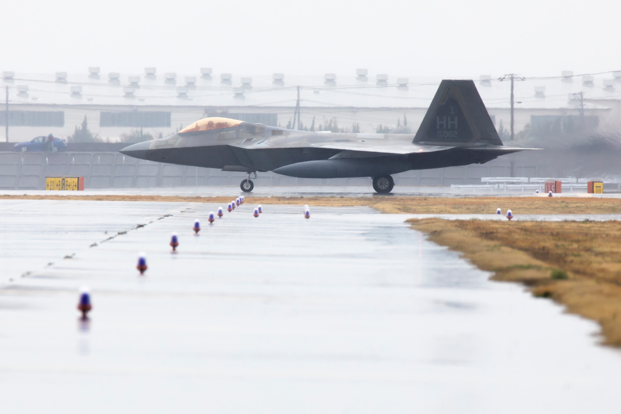 A U.S. Air Force F-22 Raptor with the 199th Fighter Squadron, taxis at Marine Corps Air Station Iwakuni Japan, March 12, 2021. Airmen with the 199th Fighter Squadron and the 19th Fighter Squadron, based out of Joint Base Pearl Harbor-Hickam, Hawaii, deployed to MCAS Iwakuni to conduct local area training with U.S. Marine Corps units. Pacific Air Forces’ fighters stand ready to support the global strategic environment as it continues to demand flexibility and freedom of action. The Dynamic Force Employment concept will change the way the Department of Defense uses the joint force with its focus on strategic predictability and operational unpredictability. (U.S. Marine Corps photo by Lance Cpl. Tyler Harmon)