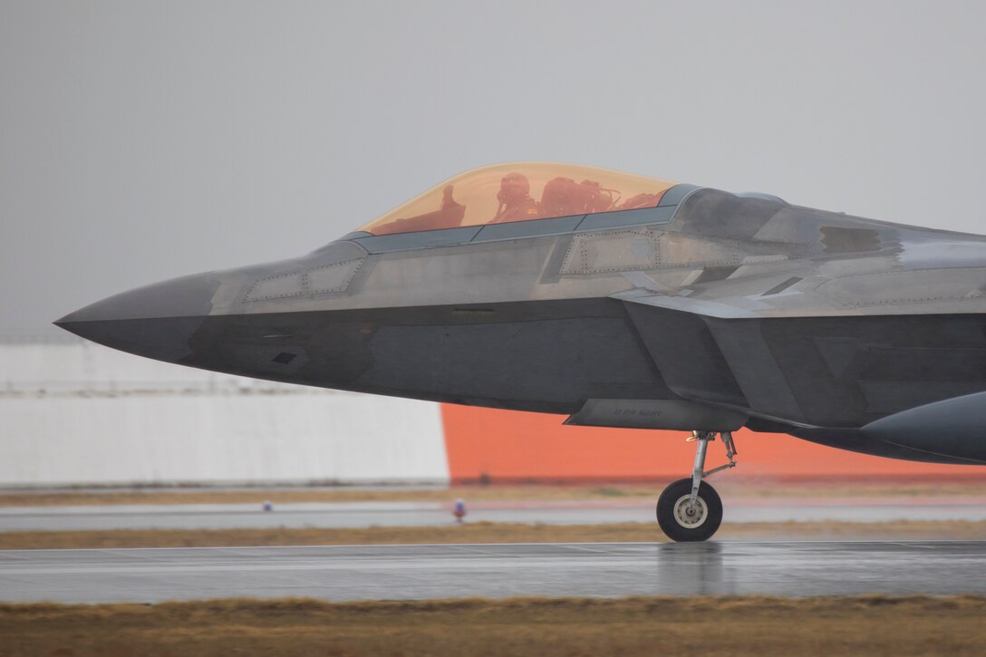 A U.S. Air Force F-22 Raptor with the 199th Fighter Squadron lands at Marine Corps Air Station Iwakuni Japan, March 12, 2021. Airmen with the 199th Fighter Squadron and the 19th Fighter Squadron, based out of Joint Base Pearl Harbor-Hickam, Hawaii, deployed to MCAS Iwakuni to conduct local area training with U.S. Marine Corps units. This training event is designed to support a free and open Indo-Pacific by providing global reach and agility throughout the area. (U.S. Marine Corps photo by Lance Cpl. Tyler Harmon)