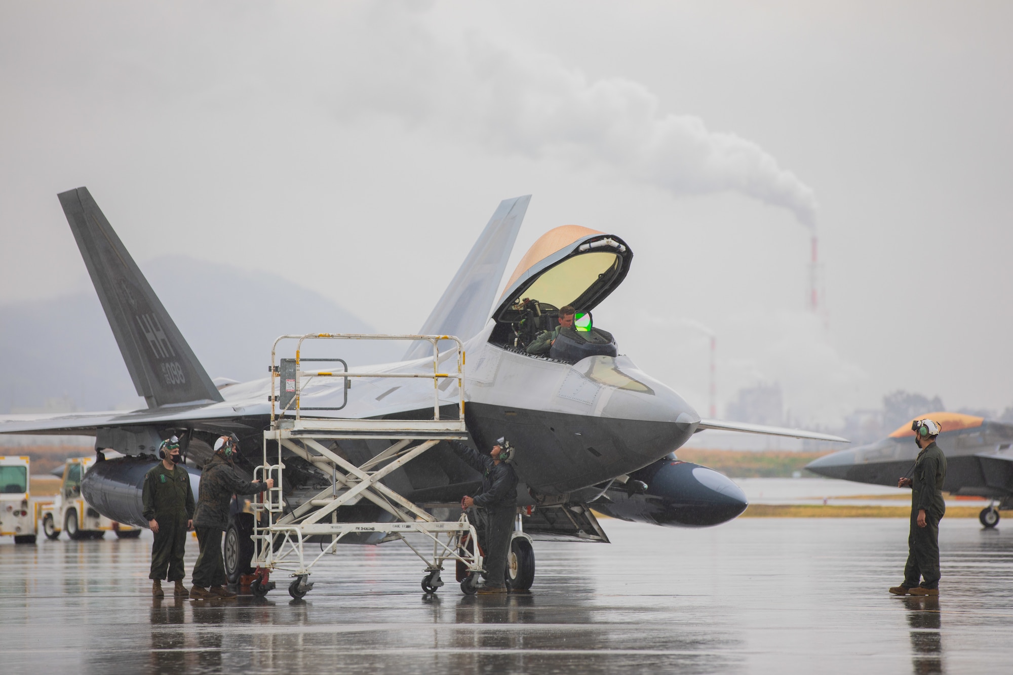 A U.S. Air Force F-22 Raptor with the 199th Fighter Squadron sits on the flight line at Marine Corps Air Station Iwakuni, Japan, March 12, 2021. Airmen with the 199th Fighter Squadron and the 19th Fighter Squadron, based out of Joint Base Pearl Harbor-Hickam, Hawaii, deployed to MCAS Iwakuni to conduct local area training with U.S. Marine Corps units. Pacific Air Forces’ fighters stand ready to support the global strategic environment as it continues to demand flexibility and freedom of action. The Dynamic Force Employment concept will change the way the Department of Defense uses the joint force with its focus on strategic predictability and operational unpredictability. (U.S. Marine Corps photo by Lance Cpl. Triton Lai)