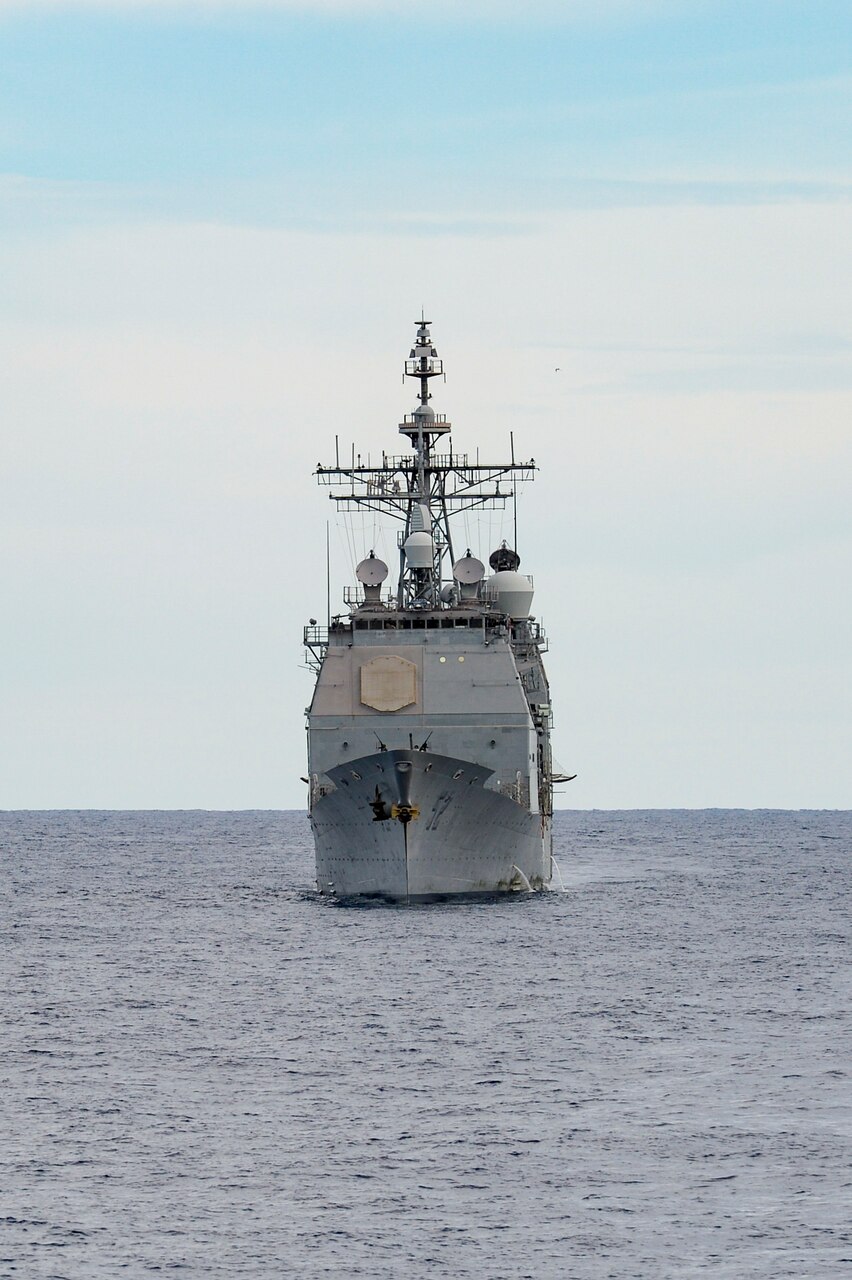 INDIAN OCEAN (March 12, 2021) The Ticonderoga-class guided-missile cruiser USS Bunker Hill (CG 52) transits the Indian Ocean during a surface target exercise March 12, 2021. Bunker Hill, part of the Theodore Roosevelt Carrier Strike Group, is on a scheduled deployment to the U.S. 7th Fleet area of operations. As the U.S. Navy’s largest forward-deployed fleet, 7th Fleet routinely operates and interacts with 35 maritime nations while conducting missions to preserve and protect a free and open Indo-Pacific. (U.S. Navy photo by Mass Communication Specialist 3rd Class Wade Costin)