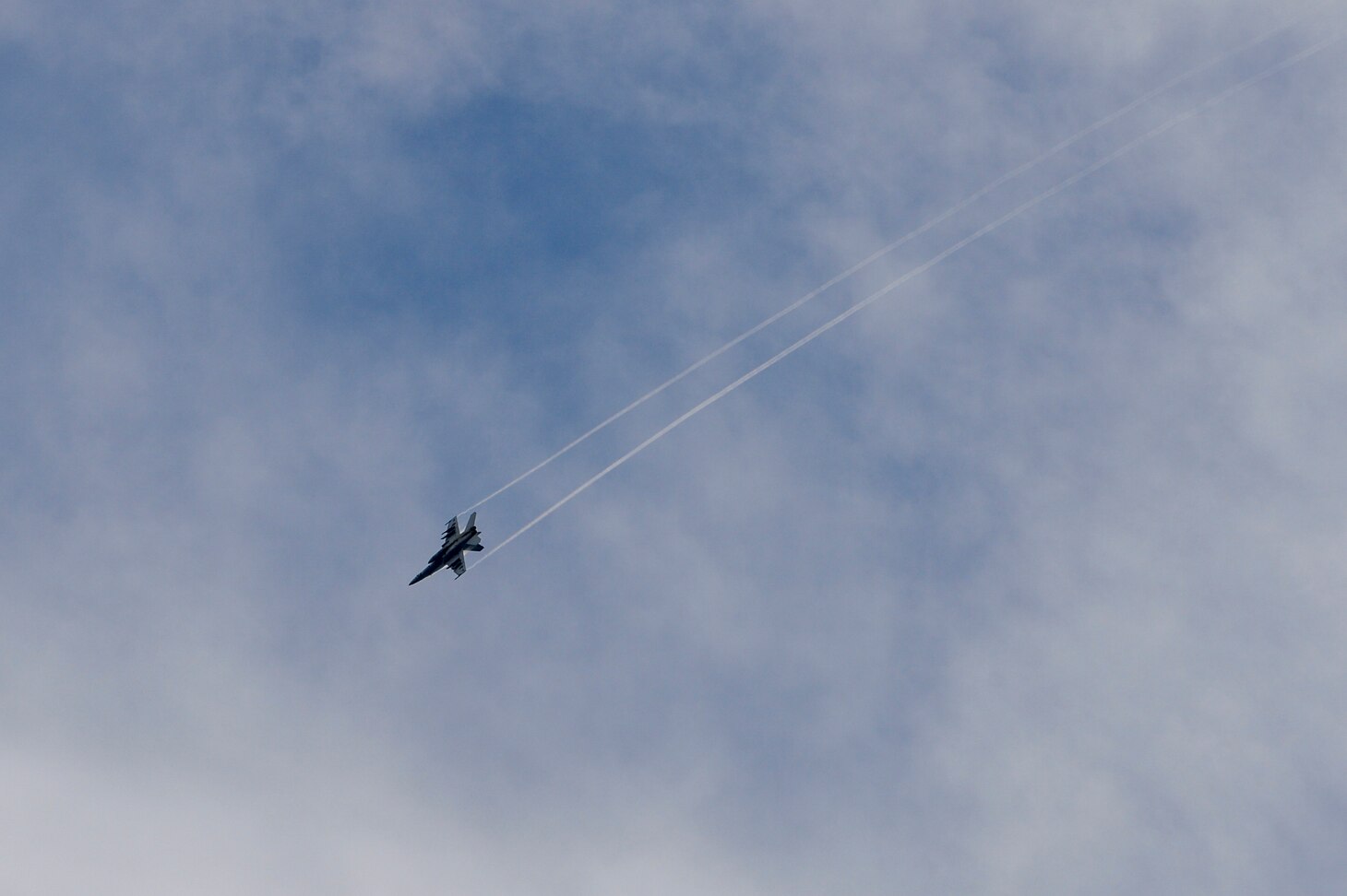 INDIAN OCEAN (March 12, 2021) An F/A-18 Super Hornet flies above the Arleigh Burke-class guided-missile destroyer USS Russell (DDG 59) during a surface target exercise March 12, 2021. Russell, part of the Theodore Roosevelt Carrier Strike Group, is on a scheduled deployment to the U.S. 7th Fleet area of operations. As the U.S. Navy’s largest forward-deployed fleet, 7th Fleet routinely operates and interacts with 35 maritime nations while conducting missions to preserve and protect a free and open Indo-Pacific. (U.S. Navy photo by Mass Communication Specialist 3rd Class Wade Costin)