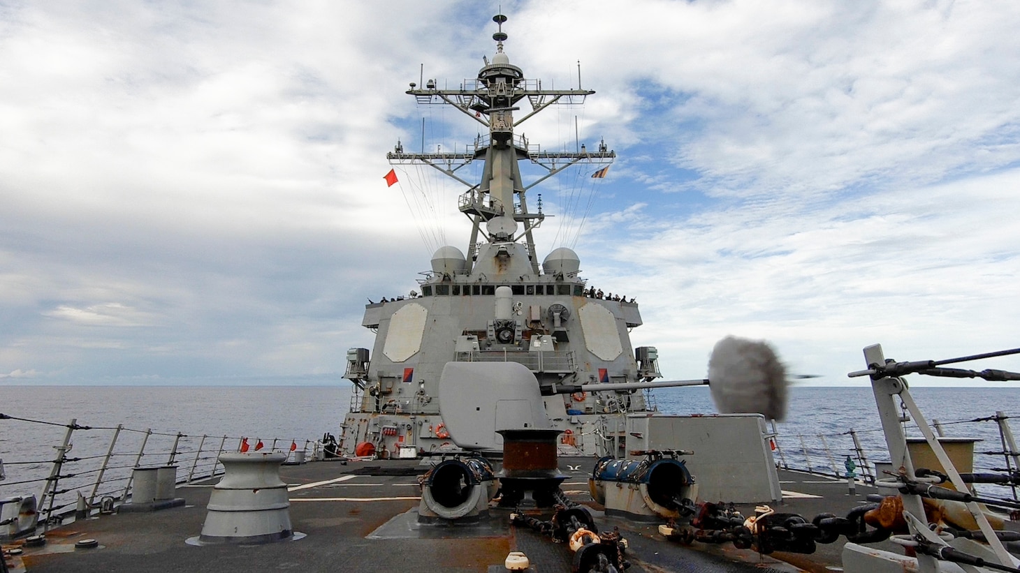 INDIAN OCEAN (March 12, 2021) The Arleigh Burke-class guided-missile destroyer USS Russell (DDG 59) fires its Mark 45 5-inch gun during a surface target exercise March 12, 2021. Russell, part of the Theodore Roosevelt Carrier Strike Group, is on a scheduled deployment to the U.S. 7th Fleet area of operations. As the U.S. Navy’s largest forward-deployed fleet, 7th Fleet routinely operates and interacts with 35 maritime nations while conducting missions to preserve and protect a free and open Indo-Pacific. (U.S. Navy photo by Mass Communication Specialist 3rd Class Wade Costin)