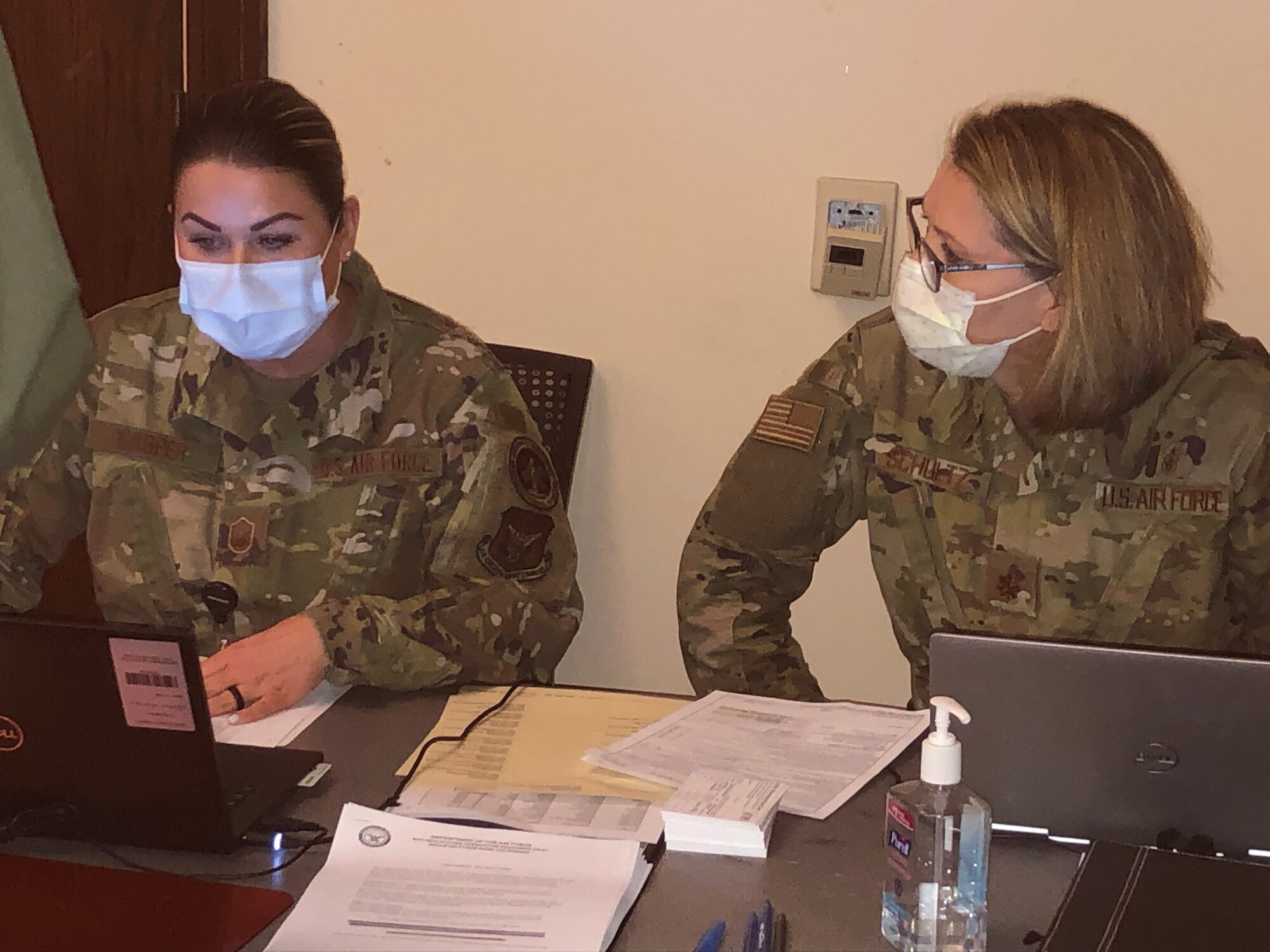 Master Sgt. Jenna Gasper, NCOIC of Immunizations and Major Dawn Schultz, AMDS/SGN nurse, record and monitor the lineup operations during process