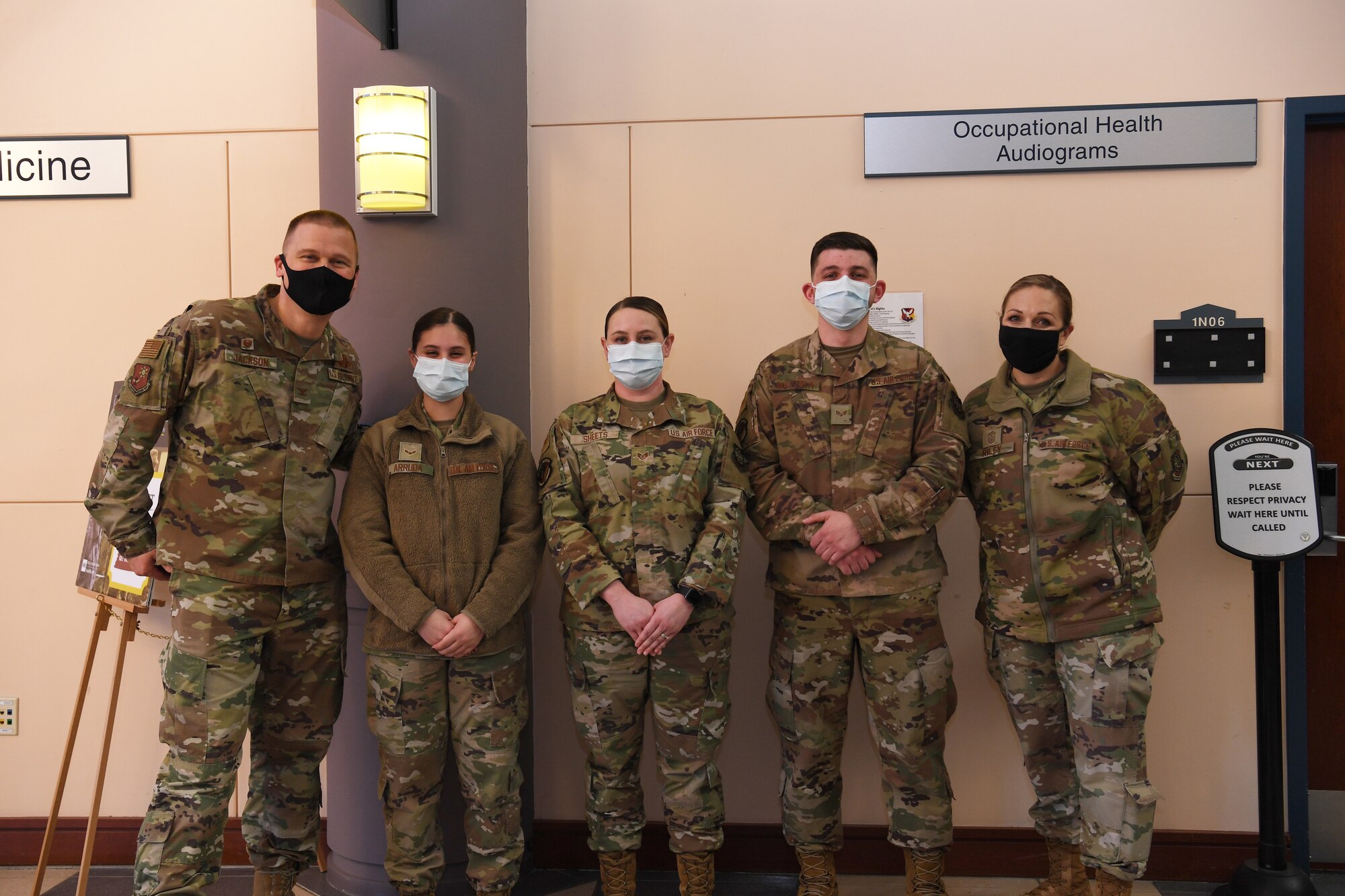 The 621st Contingency Response Wing command team stands with Airmen from the 87th Medical Group for a group photo March 15, 2021, at Joint Base McGuire-Dix-Lakehurst, New Jersey. The command team coined three Airmen for their outstanding support and professionalism helping the wing meet their deployment requirements. (U.S. Air Force photo by Tech. Sgt. Luther Mitchell Jr.)