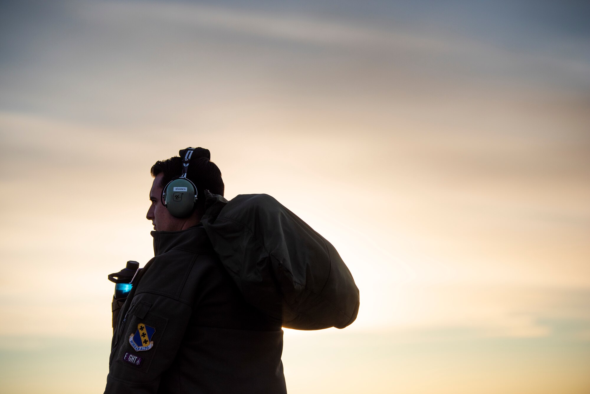 A pilot assigned to the 9th Expeditionary Bomb Squadron waits to board a B-1B Lancer at Ørland Air Force Station, Norway, March 14, 2021. The Department of Defense maintains command and control of its bomber force for any mission, anywhere in the world, at any time. (U.S. Air Force photo by Airman 1st Class Colin Hollowell)