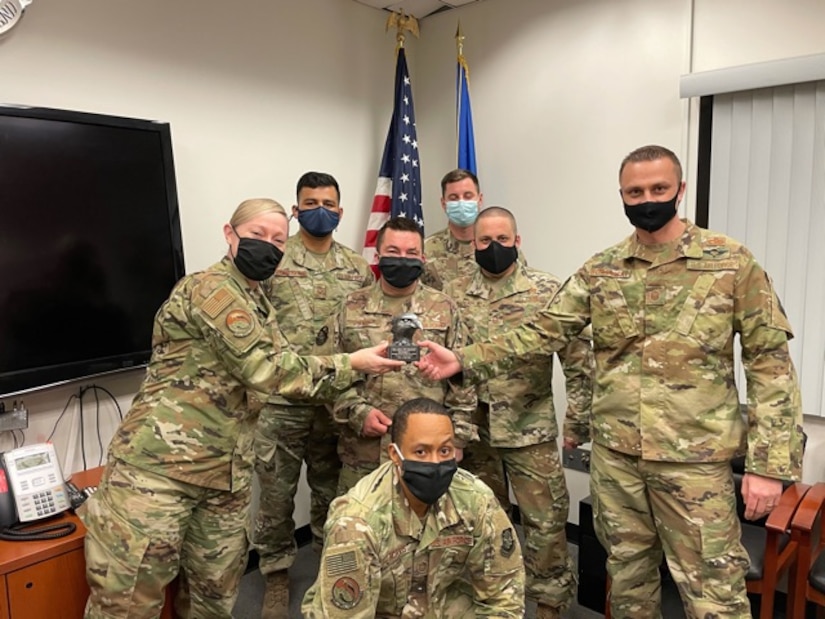 The Detachment 1 team from the 305th Aerial Port Squadron is presented with a team award. Detachment 1 is a seven-member team  that works at BWI as contract officer representatives for United States Transportation Command.