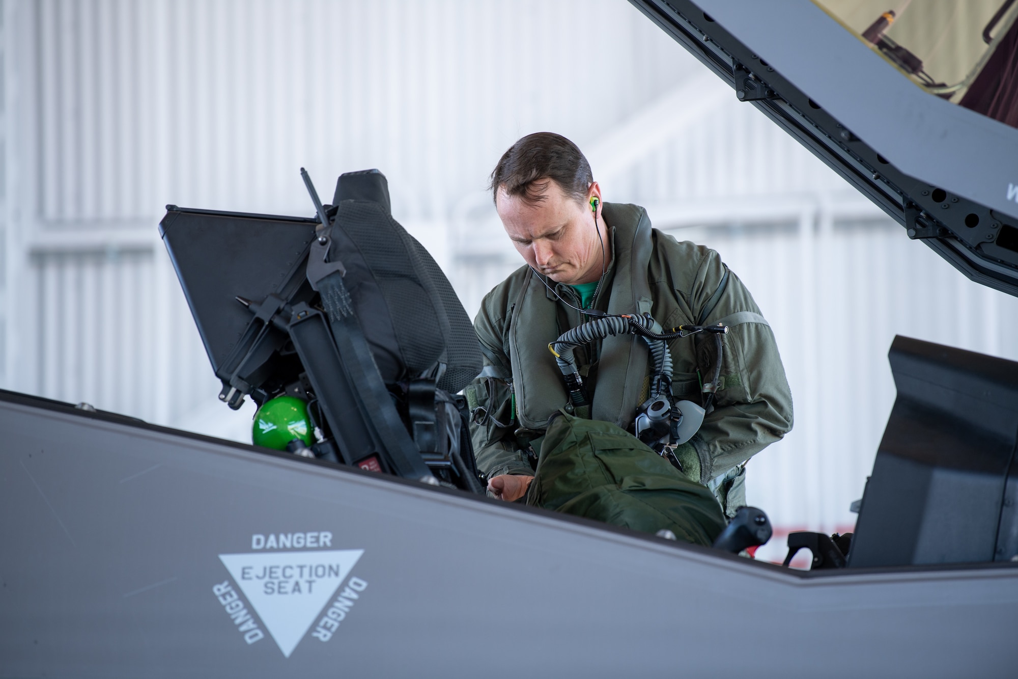 Maj. Howard “Cash” Shaner, F-35A Lightning II pilot assigned to the 134th Fighter Squadron, Vermont Air National Guard, exits an F-35 at the Vermont Air National Guard base, South Burlington, Vermont, March 12, 2021. Shaner is the first ever Air National Guard F-35 pilot to graduate from the highly competitive U.S. Air Force Weapons School. (U.S. Air National Guard photo by Mrs. Julie M. Paroline)