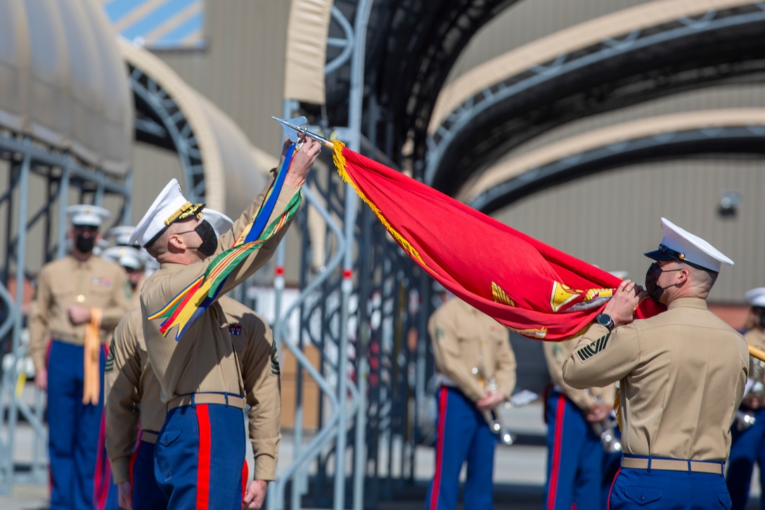 U.S. Marine Corps Lt. Col. Trevor Felter, attaches campaign streamers to his squadron’s colors during a ceremony at Marine Corps Air Station Cherry Point, North Carolina, March 5, 2021.