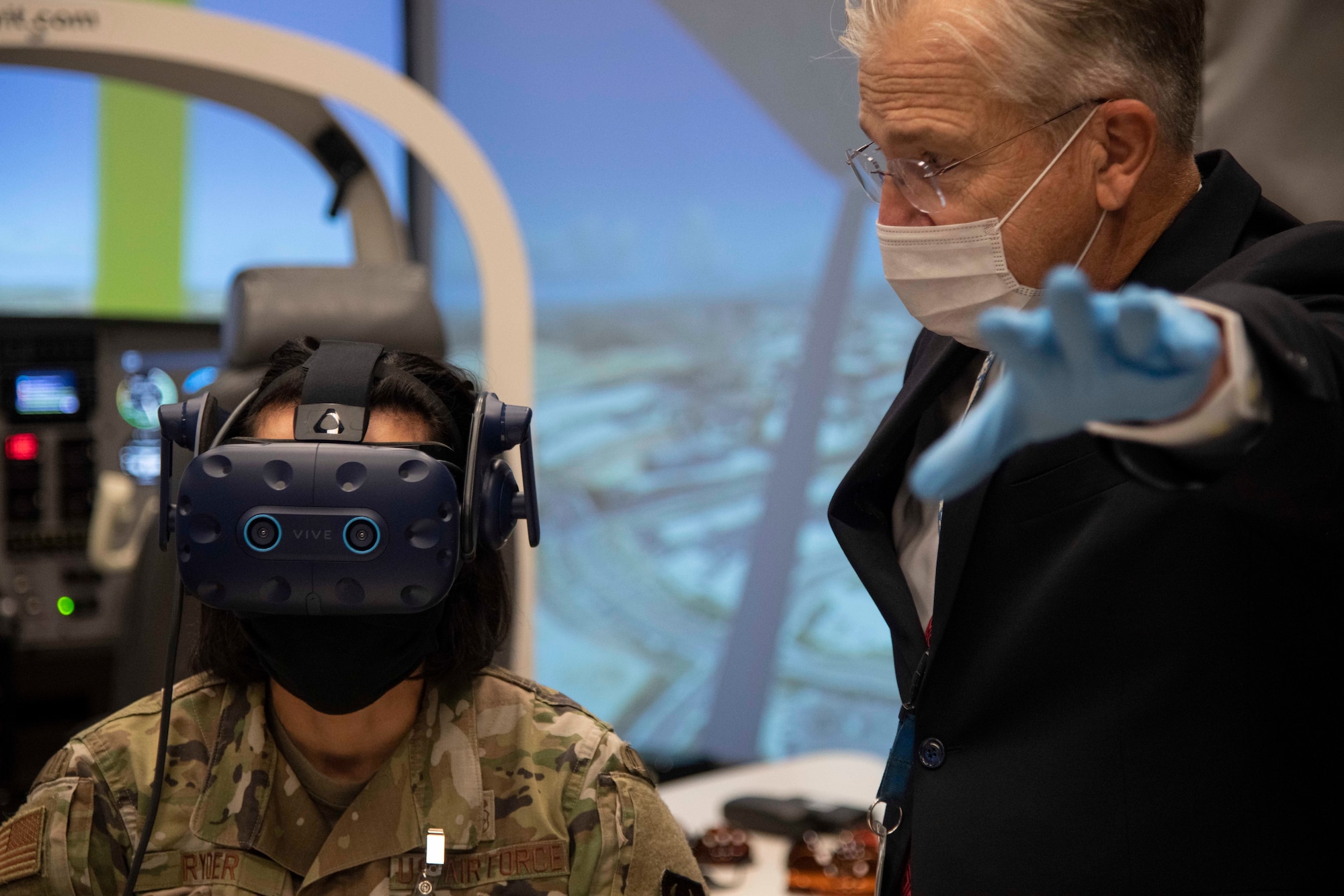 U.S. Air Force Brig. Gen. Jeannine M. Ryder, Commander, 711th Human Performance Wing, receives instruction on the virtual reality headset from Dr. Leon N. McLin, Senior Research Optometrist and Vision Scientist in the Optical Radiation Bioeffects Branch of the Airman Systems Directorate, during a tour of the Tri-services Research Laboratory (TSRL) on Joint Base San Antonio Fort Sam Houston, Texas, Nov. 5, 2020. The new 181,000-square-foot TSRL houses Navy, Air Force and Army research programs. (U.S. Air Force Photo/Jose A. Torres Jr.)