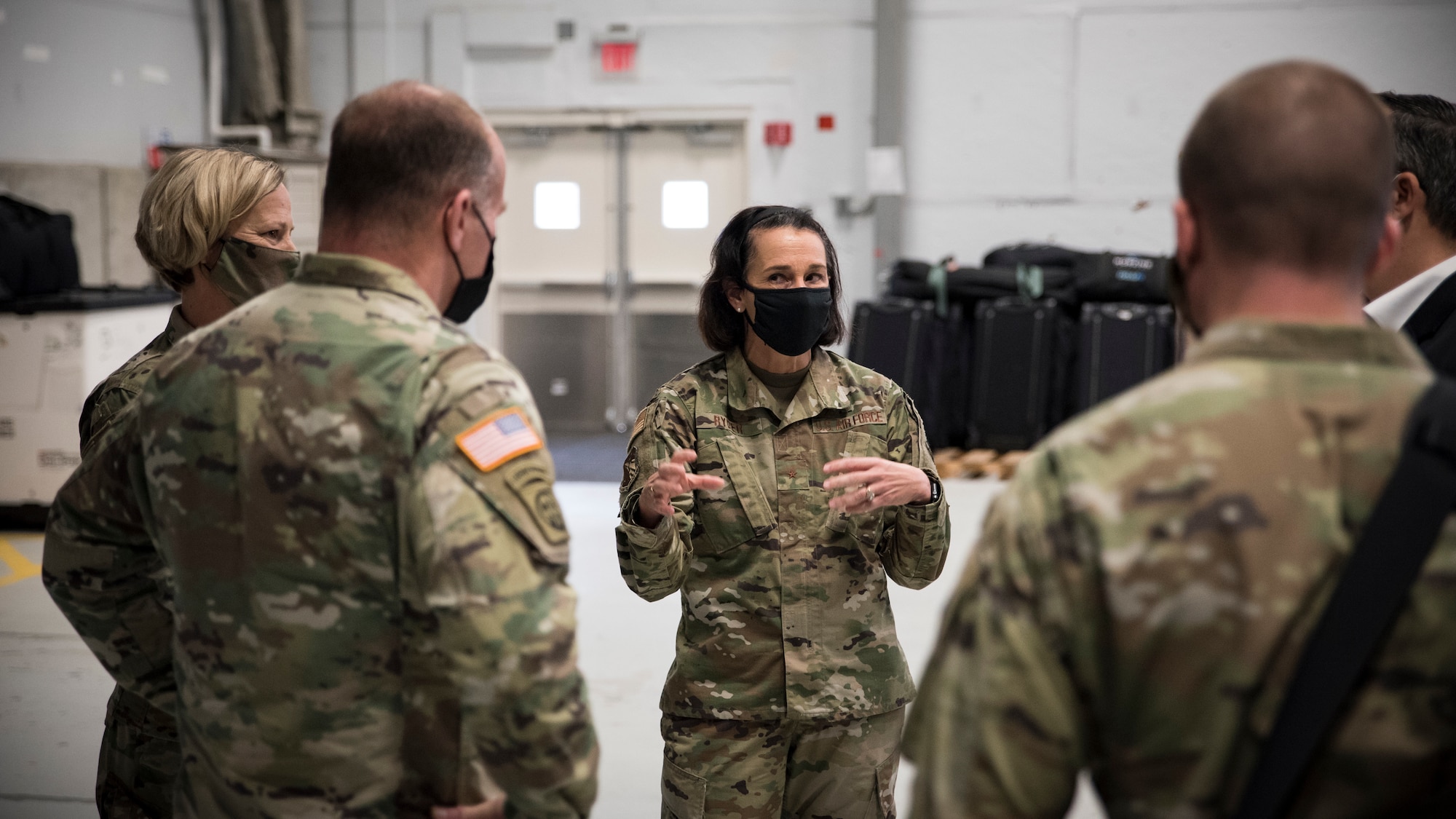 Brig. Gen. Jeannine Ryder, Commander, 711th Human Performance Wing, speaks to Gen. Steven Lyons, Commander, USTRANSCOM, and Brig. Gen. Heather Pringle, Commander, Air Force Research Laboratory, during Lyons' visit to the Wing Oct. 31, 2020. During this visit, Gen. Lyons was given briefings on several COVID-19 efforts supporting USTRANSCOM missions, including infectious disease training for aeromedical evacuation personnel. (U.S. Air Force photo/Richard Eldridge)