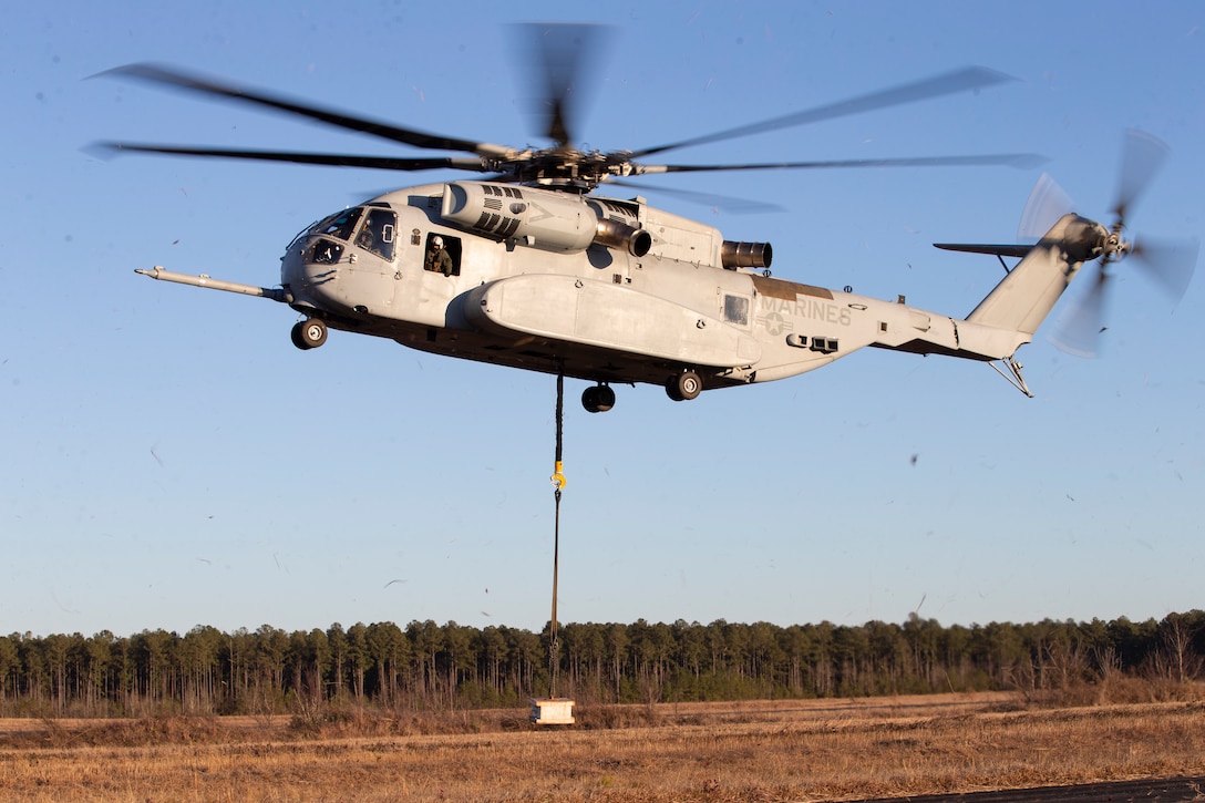 A CH-53K "King Stallion" conducts an external lift of a 4,000 pound concrete block at Marine Corps Outlying Field Camp Davis, North Carolina, Feb. 3, 2021.