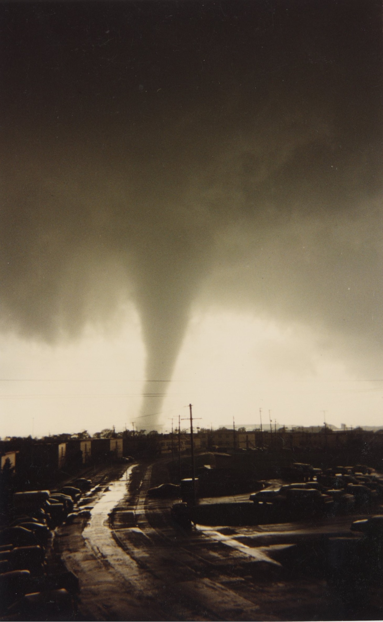 A tornado strikes military housing. April 16, 1991, at McConnell Air Force Base, Kansas. Over 100 housing units and nine major facilities were destroyed and damaged by the tornado during the most severe storm season ever recorded in Kansas. (U.S. Air Force photo by Senior Airman Nilsa Garcia)
