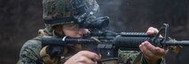A U.S. Marine fires an M4 carbine during military operations on urbanized terrain training as part of Marine Expeditionary Force 20.1 on Fort Drum, New York Nov. 1.