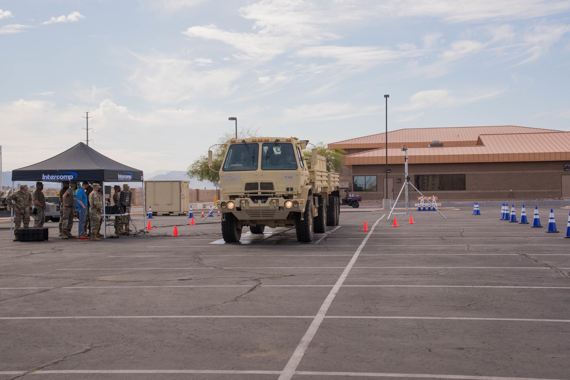 Members of the Arizona National Guard receive instruction on the operation of the Deployable Automated Cargo Measuring System during a training event at the Goldwater Air National Guard Base, Feb. 10, 2021. This system will streamline the pre-flight processing air cargo specialists take in preparing vehicles for shipment on aircraft. (U.S. Air National Guard photo by 2nd Lt. Wes Parrell)