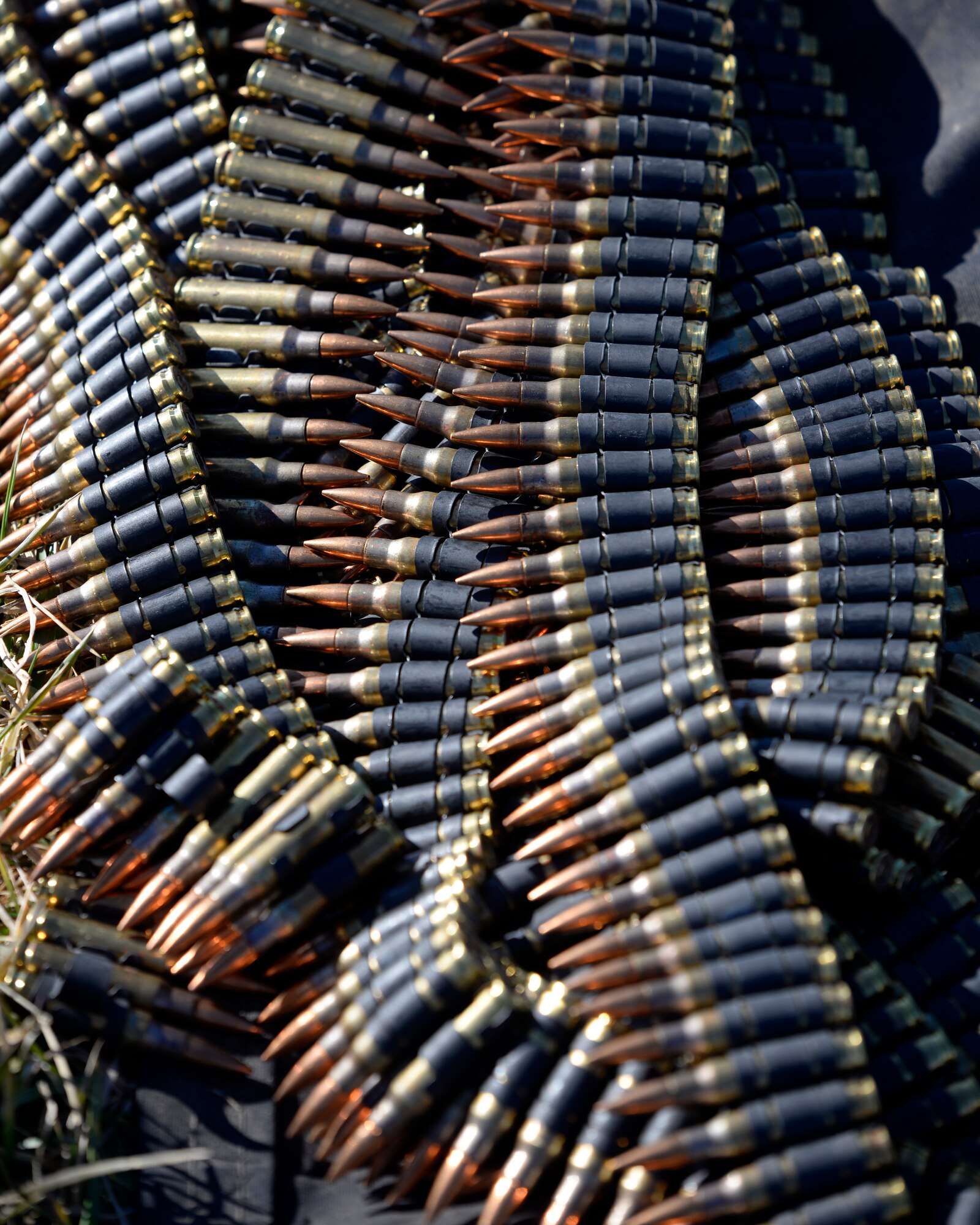 Belts of 7.62mm ammunition ready for an M240B machine gun used in training with the 88th Security Forces Squadron combat arms instructors at Camp Atterbury in Edinburgh, Indiana, on Feb. 25, 2021. The 88th SFS combat arms instructors, from Wright-Patterson Air Force Base, Ohio, travel to Camp Atterbury multiple times each year for readiness and qualification training with deployers on machine guns and grenade launchers. (U.S. Air Force photo by Ty Greenlees)