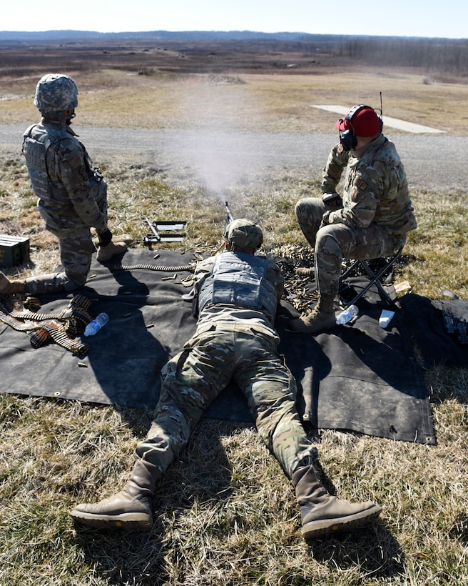 Air Force Airman 1st Class Aaron Edge, an 88th Security Forces Squadron defender, from Wright-Patterson Air Force Base, Ohio, fires an M240B machine gun at Camp Atterbury in Edinburgh, Indiana, on Feb. 25, 2021. Members of the 88th SFS, travel to Camp Atterbury multiple times each year for readiness and qualification training with deployers on machine guns and grenade launchers. (U.S. Air Force photo by Ty Greenlees)