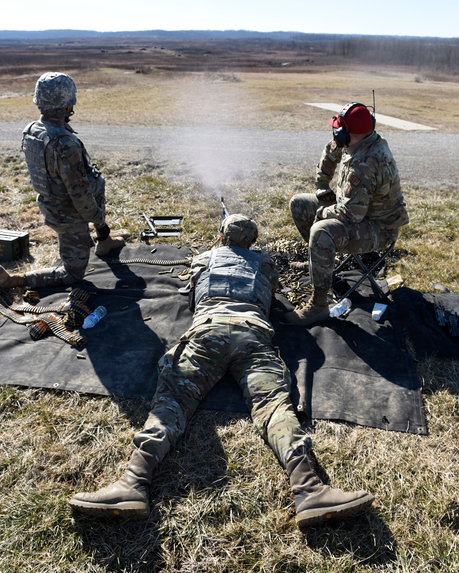 Air Force Airman 1st Class Aaron Edge, an 88th Security Forces Squadron defender, from Wright-Patterson Air Force Base, Ohio, fires an M240B machine gun at Camp Atterbury in Edinburgh, Indiana, on Feb. 25, 2021. Members of the 88th SFS, travel to Camp Atterbury multiple times each year for readiness and qualification training with deployers on machine guns and grenade launchers. (U.S. Air Force photo by Ty Greenlees)