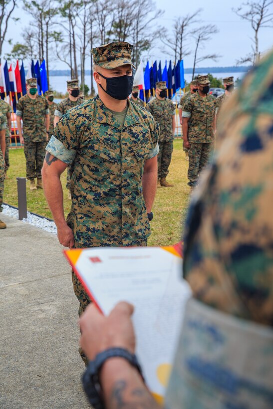 U.S. Marine Corps Sgt. Danny McDonald, scout sniper with 2d Battalion, 6th Marine Regiment, 2d Marine Division, is awarded the Navy and Marine Corps Medal at Camp Lejeune, N.C., March 17, 2021. McDonald was awarded for his selfless actions in Surf City, N.C., May 4, 2019, where he risked his own life to save a 10-year-old child from drowning. The child was caught in a rip current that carried him approximately 300 feet from shore.(U.S. Marine Corps photo by Cpl. Elijah Abernathy)