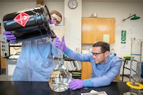 Anthony Painter, left, and Deniz Ferrin, both chemists, Code 130, Quality Assurance Office, make hand sanitizer March 20, 2020, in Building 59 at Puget Sound Naval Shipyard & Intermediate Maintenance Facility in Bremerton, Washington.