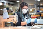 Shop 64 fabric workers at Puget Sound Naval Shipyard & Intermediate Maintenance Facility in Bremerton, Washington, make cloth masks and polycarbonate face shields that can be used to protect the workforce, or provided to Naval Hospital Bremerton and local hospitals if the need arises.