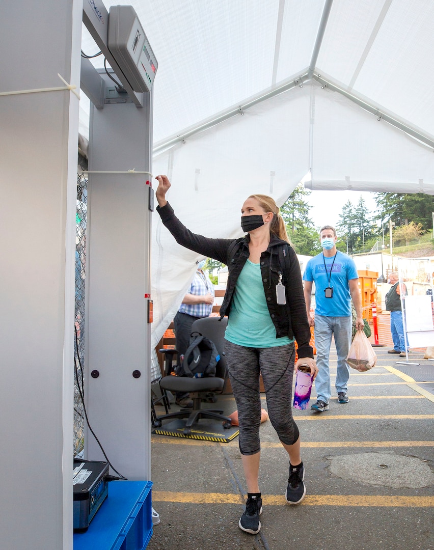 Employees complete temperature screening inside Farragut Gate at Puget Sound Naval Shipyard & Intermediate Maintenance Facility, in Bremerton, Wash.