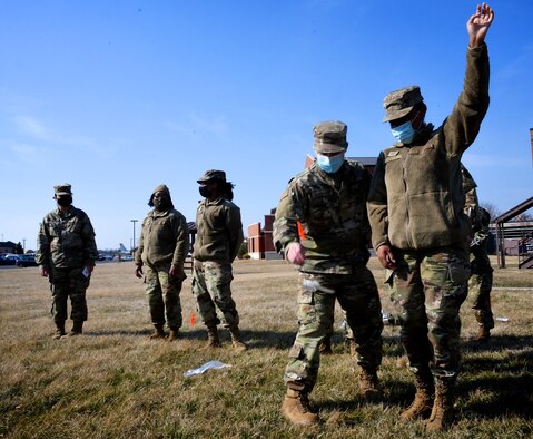 The 932nd Airlift Wing's Force Support Squadron conducts hands-on Search and Recovery training by marking an item with a flag on 8 March, 2021, Scott Air Force Base, Ill.  "FSS professionals are trained to respond in the event of an actual mishap involving Air Force assets or Air Force personnel.  This training is integral to FSS home station readiness training and is one of the largest collective functional training requirements for Force Support professionals," said Maj. Jennifer Fillmore, commander of FSS.  "Our Sustainment Flight, led by Maj. Christine Froeber and Senior Master Sgt. Jennifer Royer, led us in accomplishing training for the majority of the unit," she added.  (U.S. Air Force photo by Lt. Col. Stan Paregien)