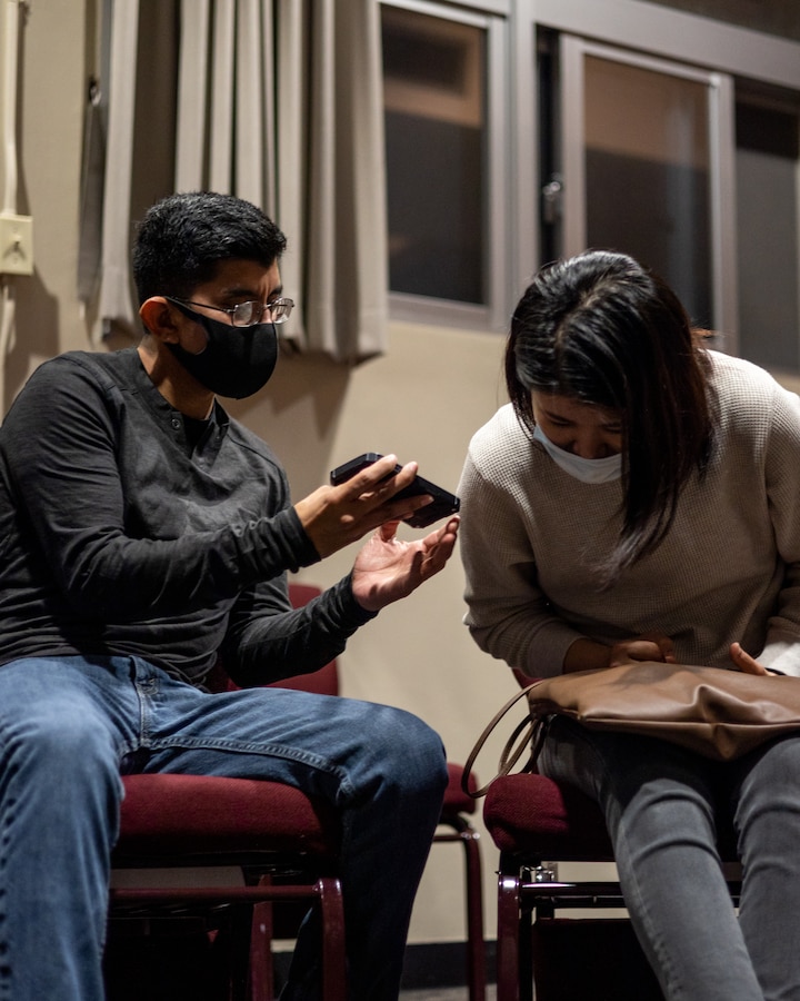 A U.S. Marine shares his music with an Okinawa resident during the English discussion class at the chapel on Marine Corps Air Station Futenma (MCAS), Okinawa, Japan, March 16, 2021. The Futenma Chapel English discussion provides U.S. Marines and Okinawa residents with an opportunity to learn each other's languages and share their cultures. The discussion is held every Tuesday at the MCAS Futenma Chapel at 6:30 p.m. (U.S. Marine Corps photo by Cpl. Terry Wong)