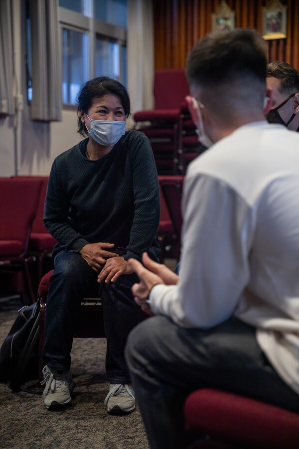 An Okinawa resident engages in a bilingual conversation with U.S. Marines during the English discussion class at the chapel on Marine Corps Air Station Futenma (MCAS), Okinawa, Japan, March 16, 2021. The Futenma Chapel English discussion provides U.S. Marines and Okinawa residents with an opportunity to learn each other's languages and share their culture. The discussion is held every Tuesday at the MCAS Futenma Chapel at 6:30 p.m. (U.S. Marine Corps photo by Cpl. Terry Wong)