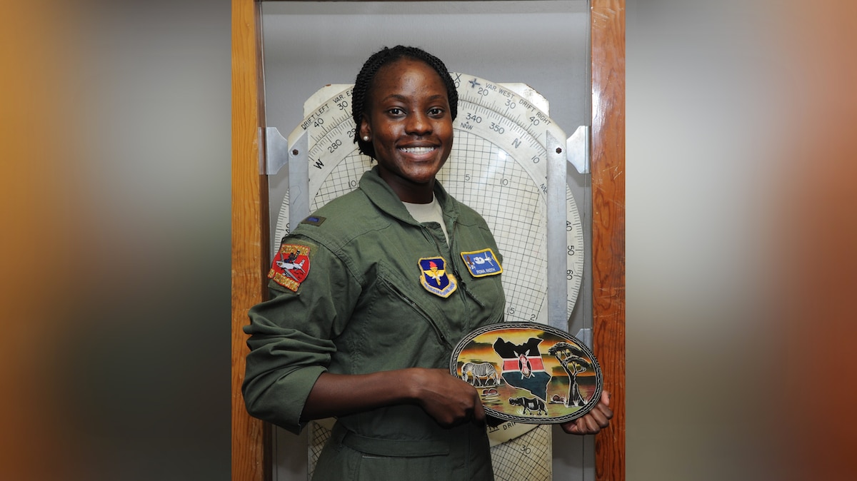 Then First Lt. Fiona Akoth, 14th Student Squadron Student Pilot, holds a ceramic Kenyan decoration. (U.S. Air Force photo by Airman 1st Class Beaux Hebert)