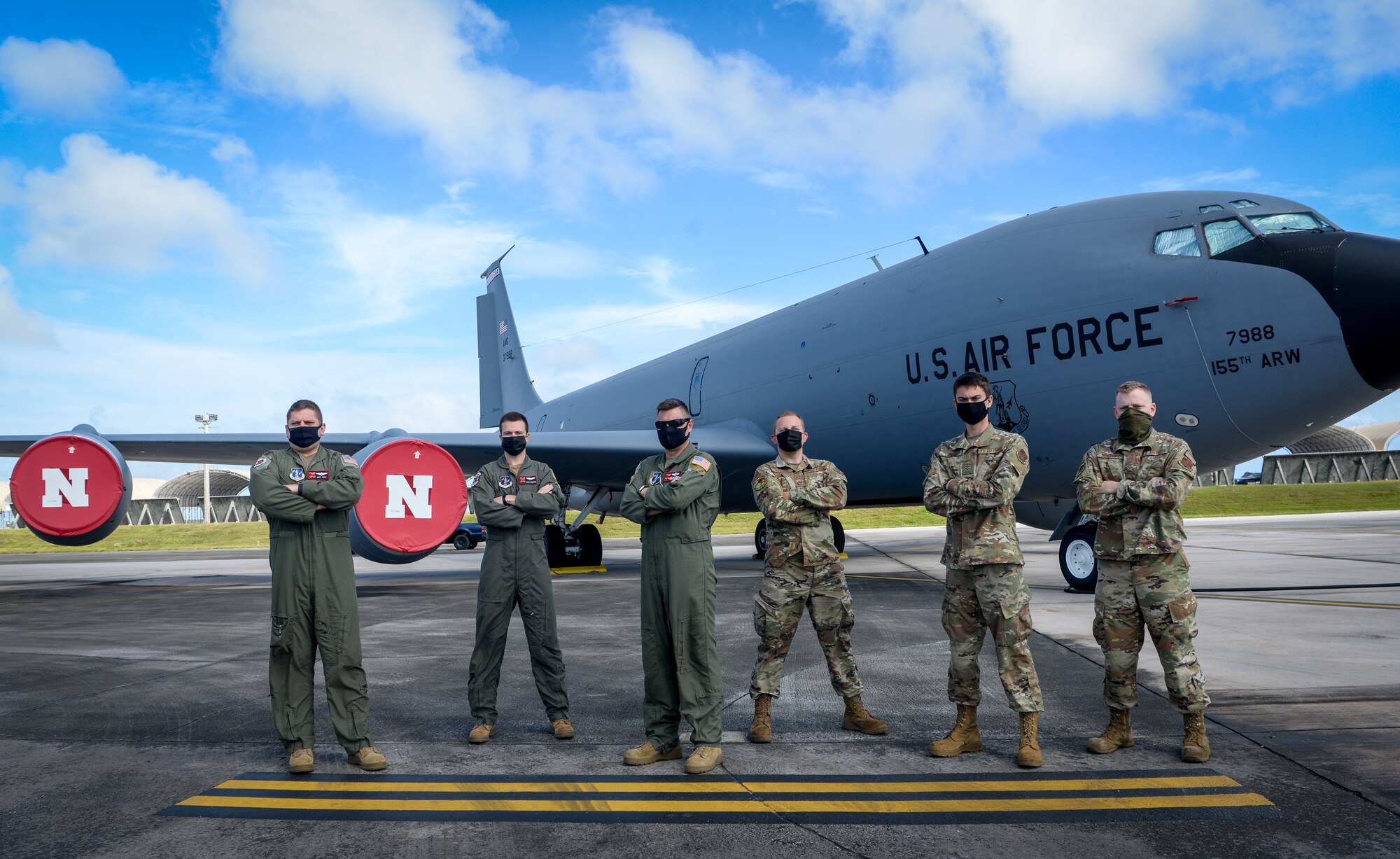 Five U.S. Air Force Guardsmen from the 155th Air Refueling Squadron, Nebraska Air National Guard, and one guardsman from the Alaska ANG, pose for a group photo on Andersen Air Force Base, Guam, Mar. 18, 2021.