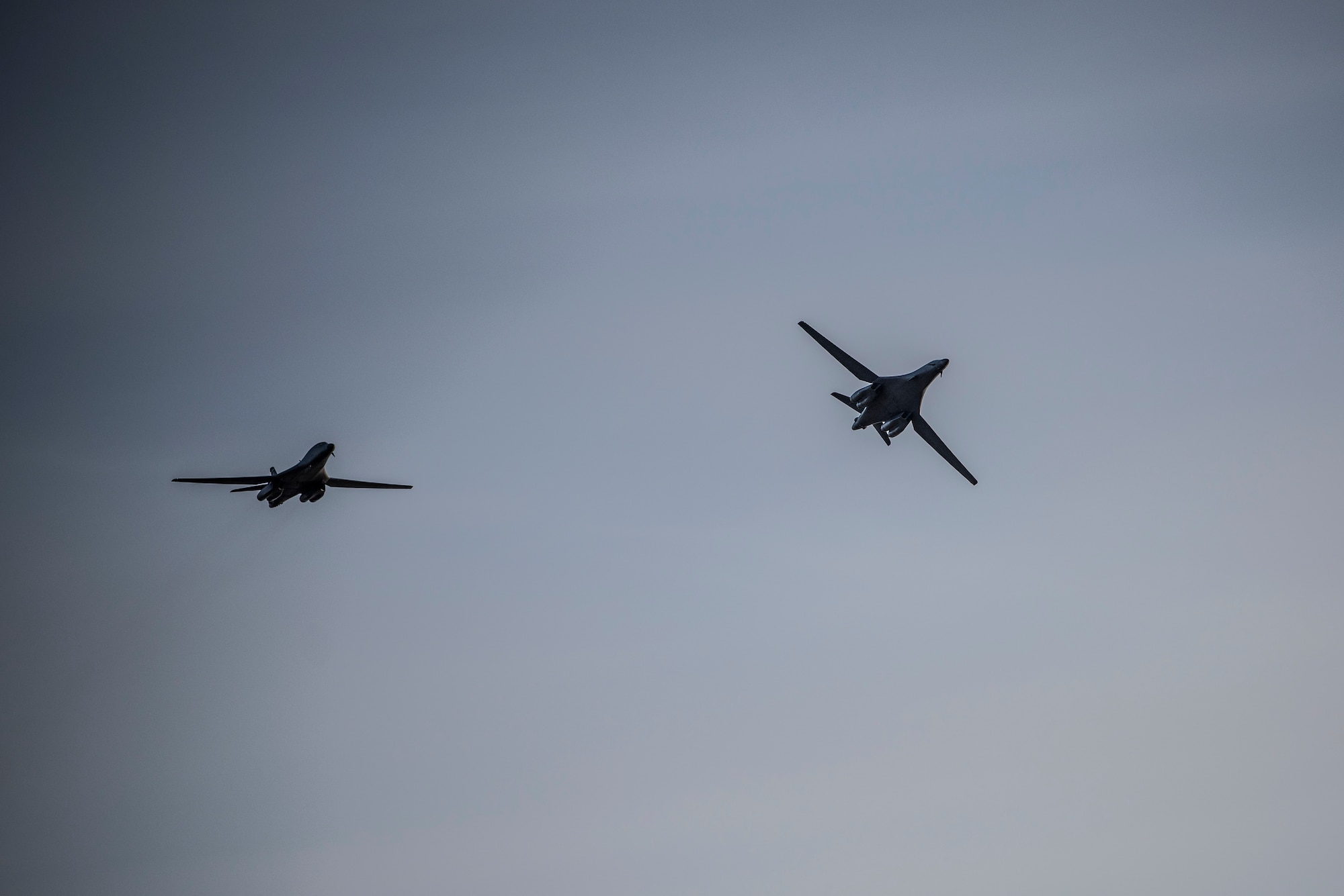 Two B-1B Lancers assigned to the 9th Expeditionary Bomb Squadron fly above Ørland Air Force Station, Norway, March 14, 2021. The 9th EBS participated in Bomber Task Force training missions that provided aircrew the opportunity to train and work with U.S. allies and partners in joint and coalition operations and exercises. (U.S. Air Force photo by Airman 1st Class Colin Hollowell)
