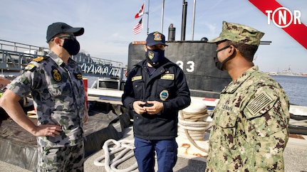 Lt. Matthew McGuire (RAN) and Lt. Reginald Caldwell speak with an officer from the Peruvian submarine BAP Pisagua (SS-33) at Naval Station Mayport. Pisagua is participating in exercises and training as part of the Diesel–Electric Submarine Initiative, now in its 20th year.