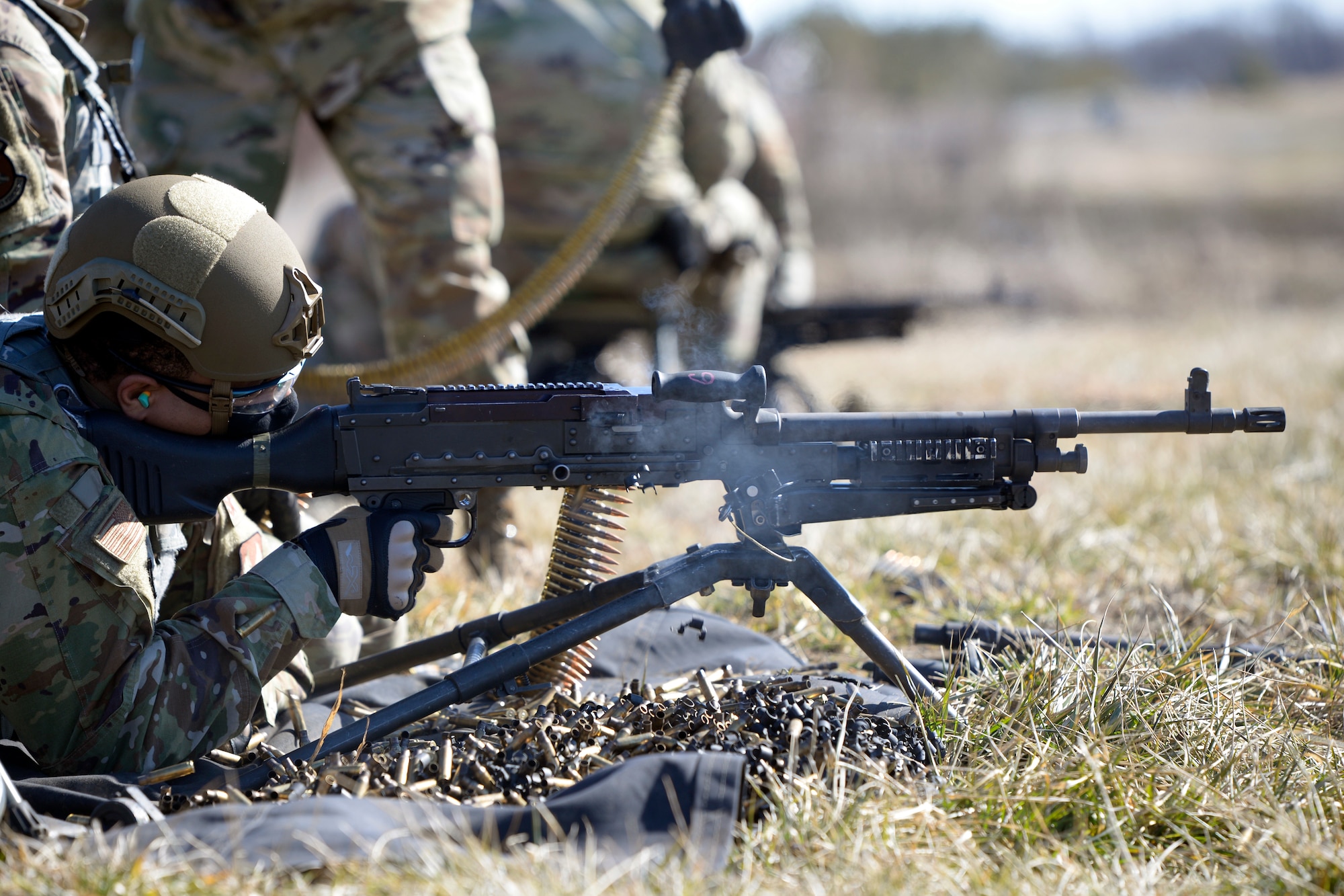 Airman 1st Class Aaron Edge, an 88th Security Forces Squadron defender, from Wright-Patterson Air Force Base, Ohio, fires an M240B machine gun at Camp Atterbury in Edinburgh, Indiana, on Feb. 25, 2021. Members of the 88th SFS, travel to Camp Atterbury multiple times each year for readiness and qualification training with deployers on machine guns and grenade launchers. (U.S. Air Force photo by Ty Greenlees)