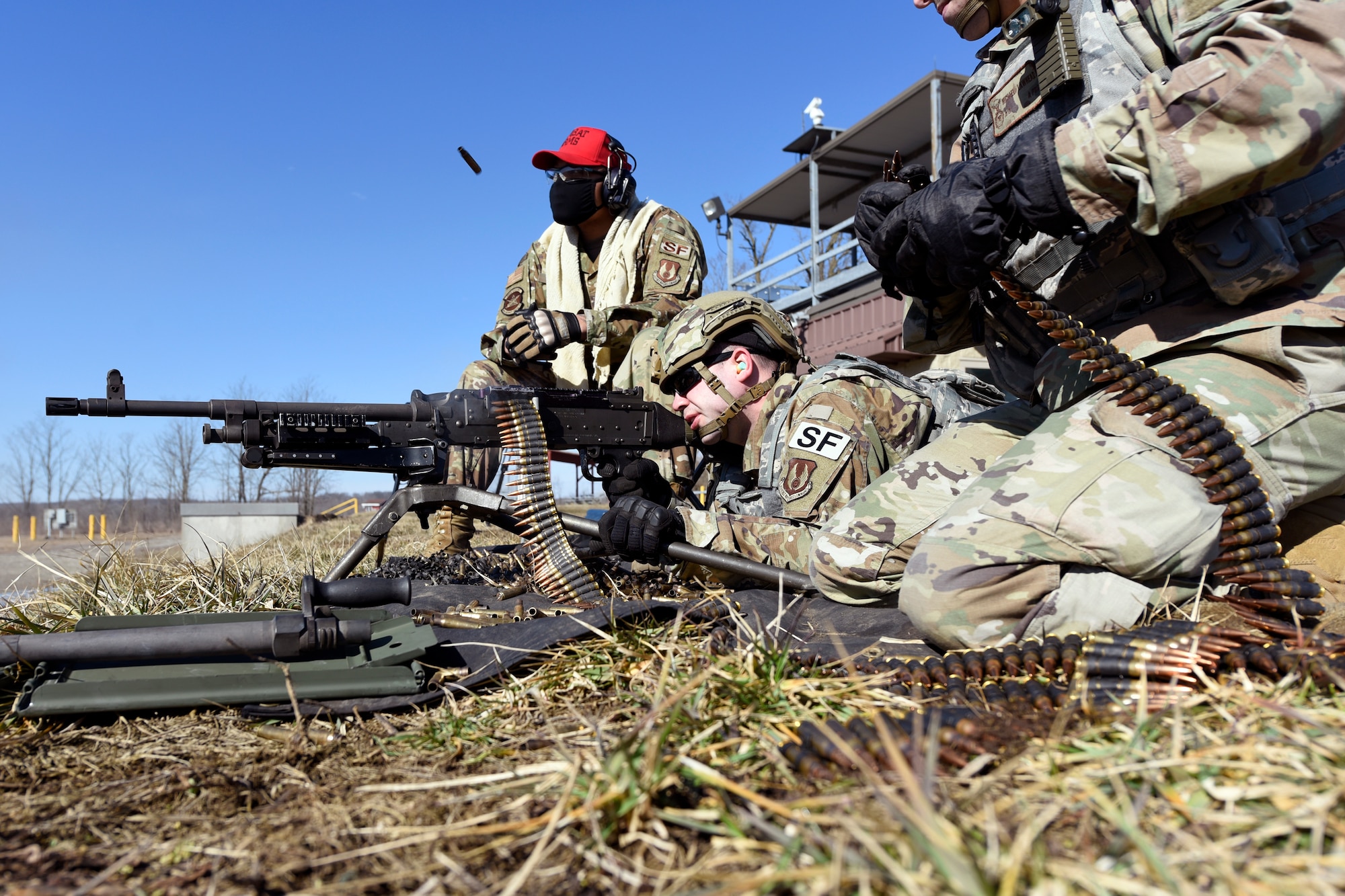 Air Force Technical Sgt. Richard Thomas, the 88th Security Forces Squadron noncommissioned officer in charge of Combat Arms, fires an M240B machine gun at Camp Atterbury in Edinburgh, Indiana, on Feb. 25, 2021. Members of the 88th SFS, travel to Camp Atterbury multiple times each year for readiness and qualification training with deployers on machine guns and grenade launchers. (U.S. Air Force photo by Ty Greenlees)