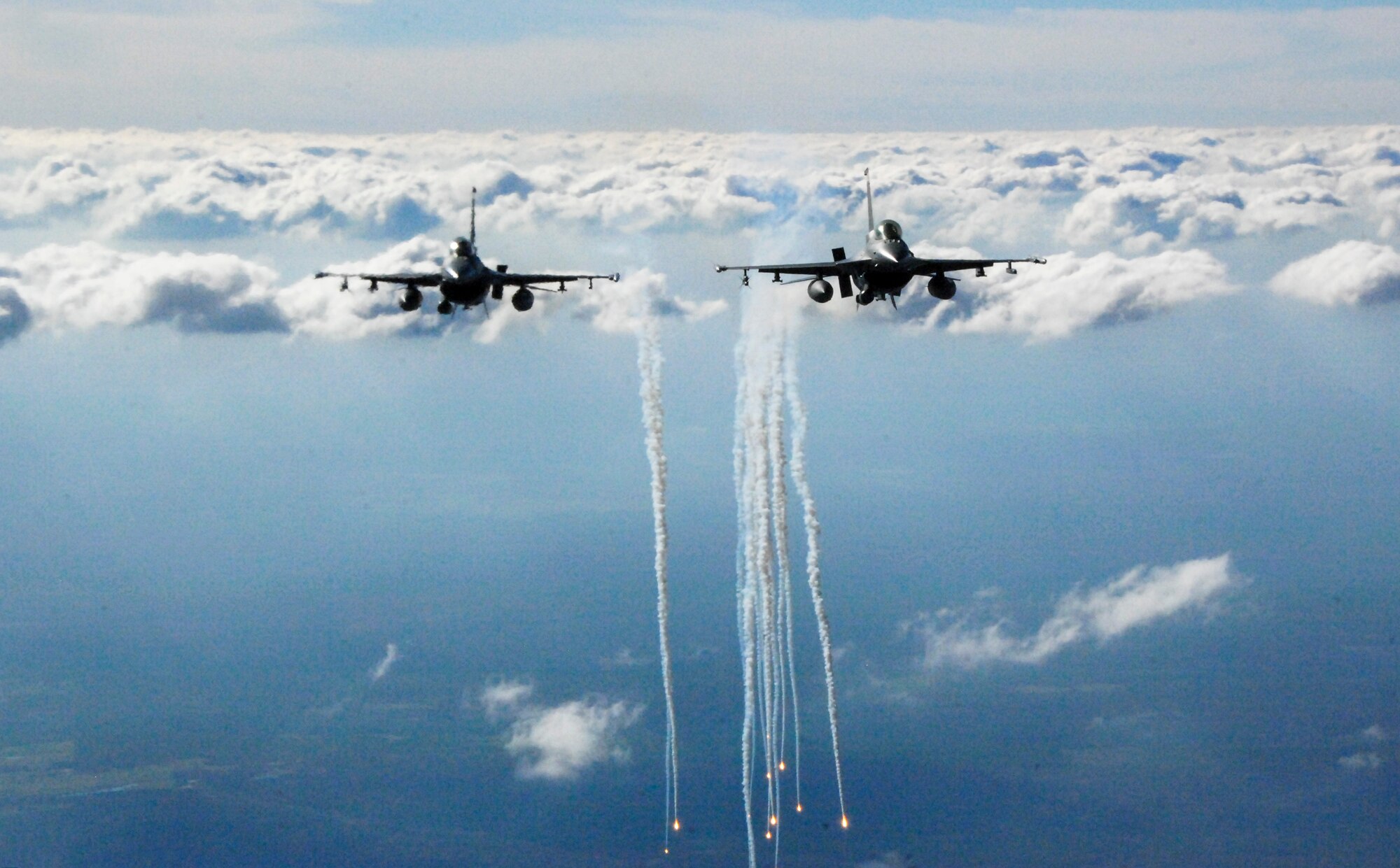 Two F-16s fly in formation
