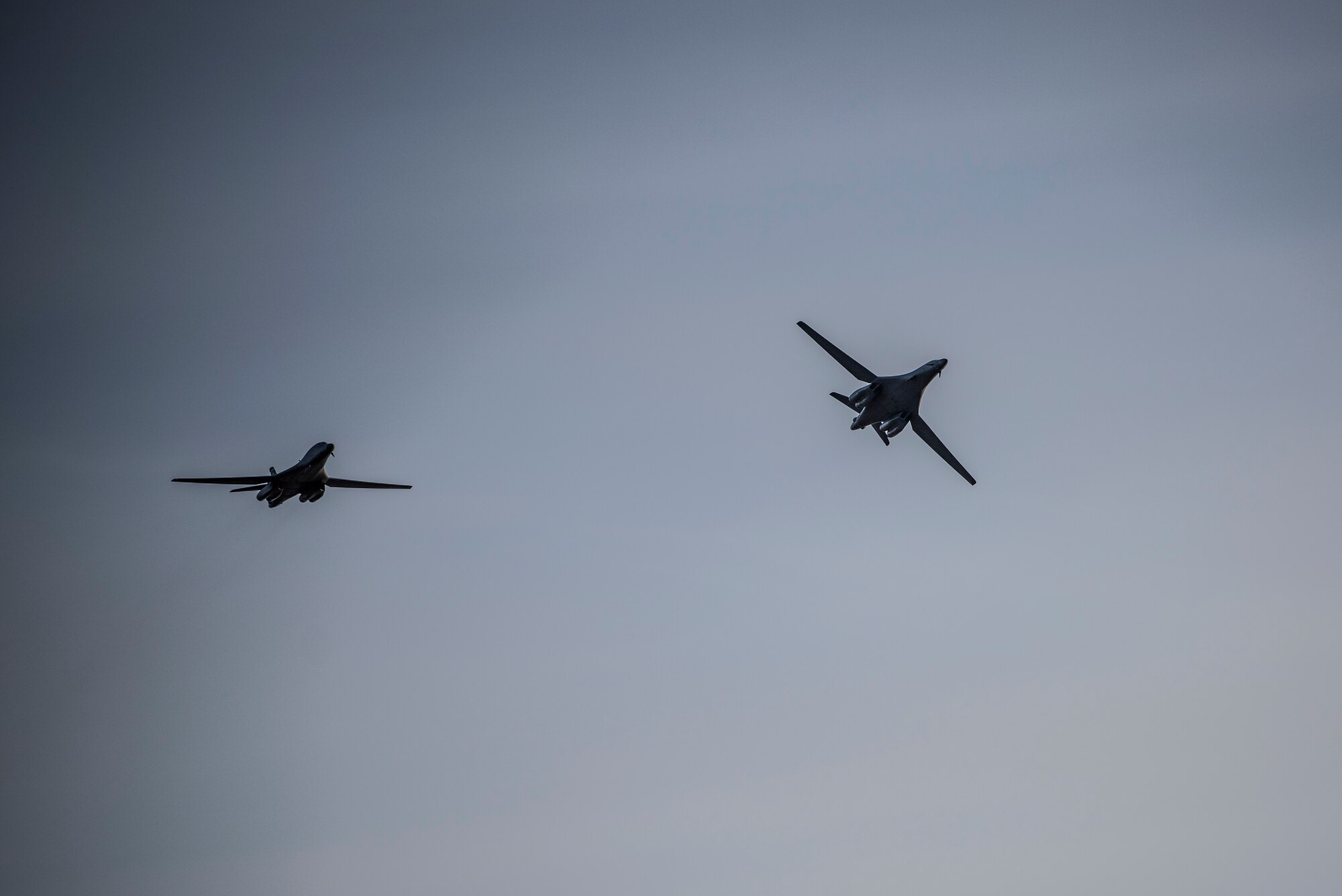 Two B-1B Lancers assigned to the 9th Expeditionary Bomb Squadron fly above Ørland Air Force Station, Norway, March 14, 2021. The 9th EBS participated in Bomber Task Force training missions that provided aircrew the opportunity to train and work with U.S. allies and partners in joint and coalition operations and exercises. (U.S. Air Force photo by Airman 1st Class Colin Hollowell)