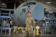 Senior Airman Jonathan Petersen, 103rd Maintenance Squadron electrical and environmental systems specialist, in front of a C-130H Hercules at Bradley Air National Guard Base in East Granby, Connecticut, March 16, 2021. Petersen attended U.S. Army Ranger School through the Air National Guard’s Enlisted Development Opportunities program, and was the only Air National Guardsman in his graduating class, which completed Feb. 5.